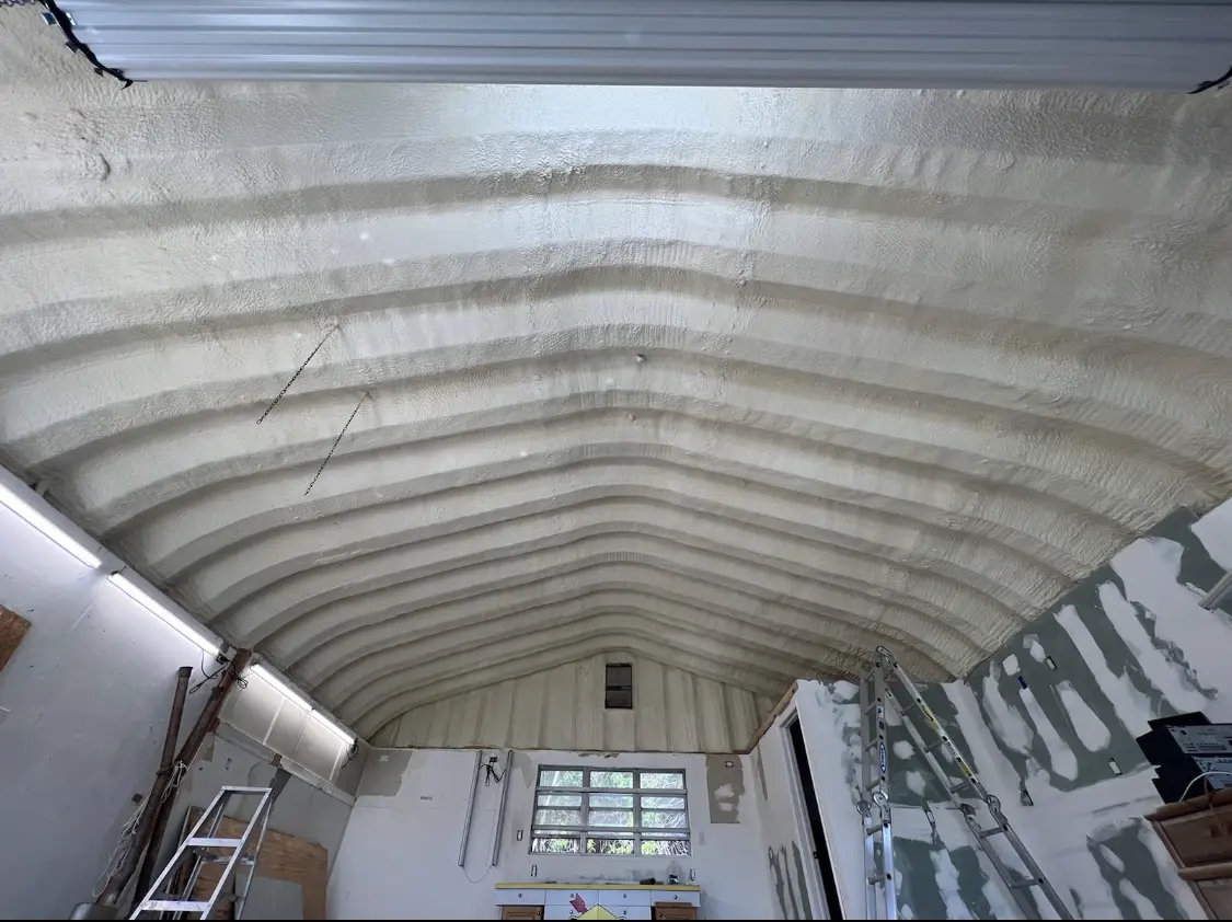 Spray polyurethane foam applied to the underside of a metal roof deck in Fort Irwin